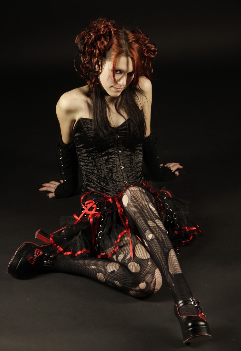 Redhead Gothic Girl wearing Black Sheer Ripped Pantyhose on Black Fishnet Tights